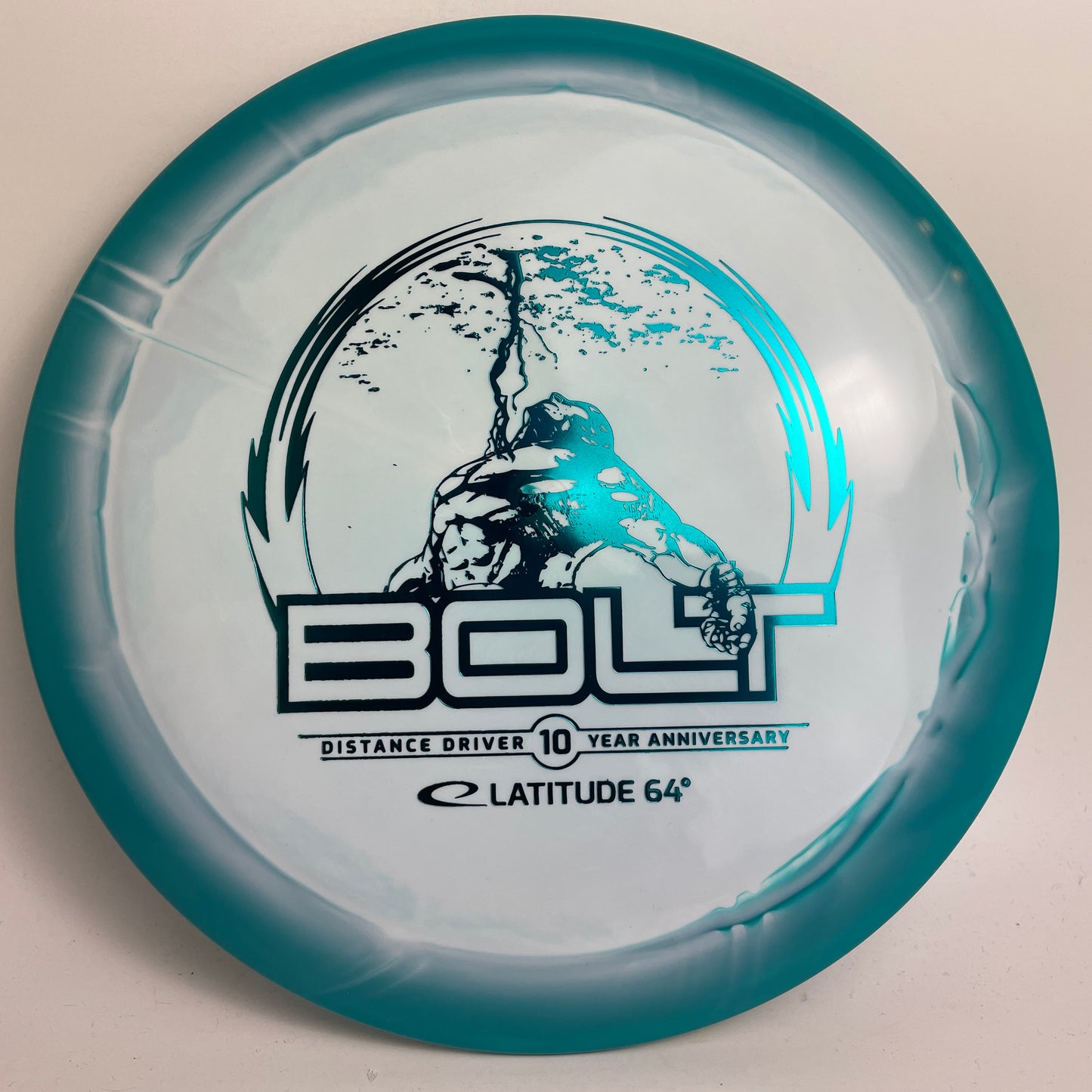 Latitude 64 Gold Orbit Bolt 10 Year Anniversary Stamp